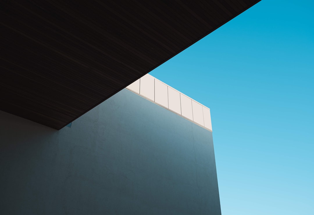 gray concrete building under clear blue sky during daytime