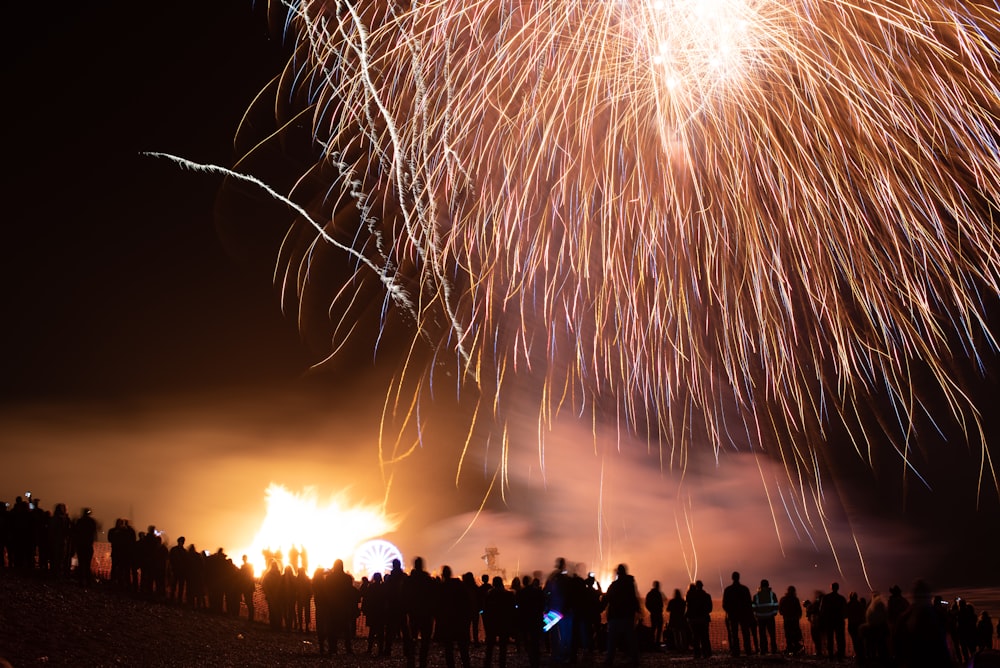 a group of people watching a fireworks display