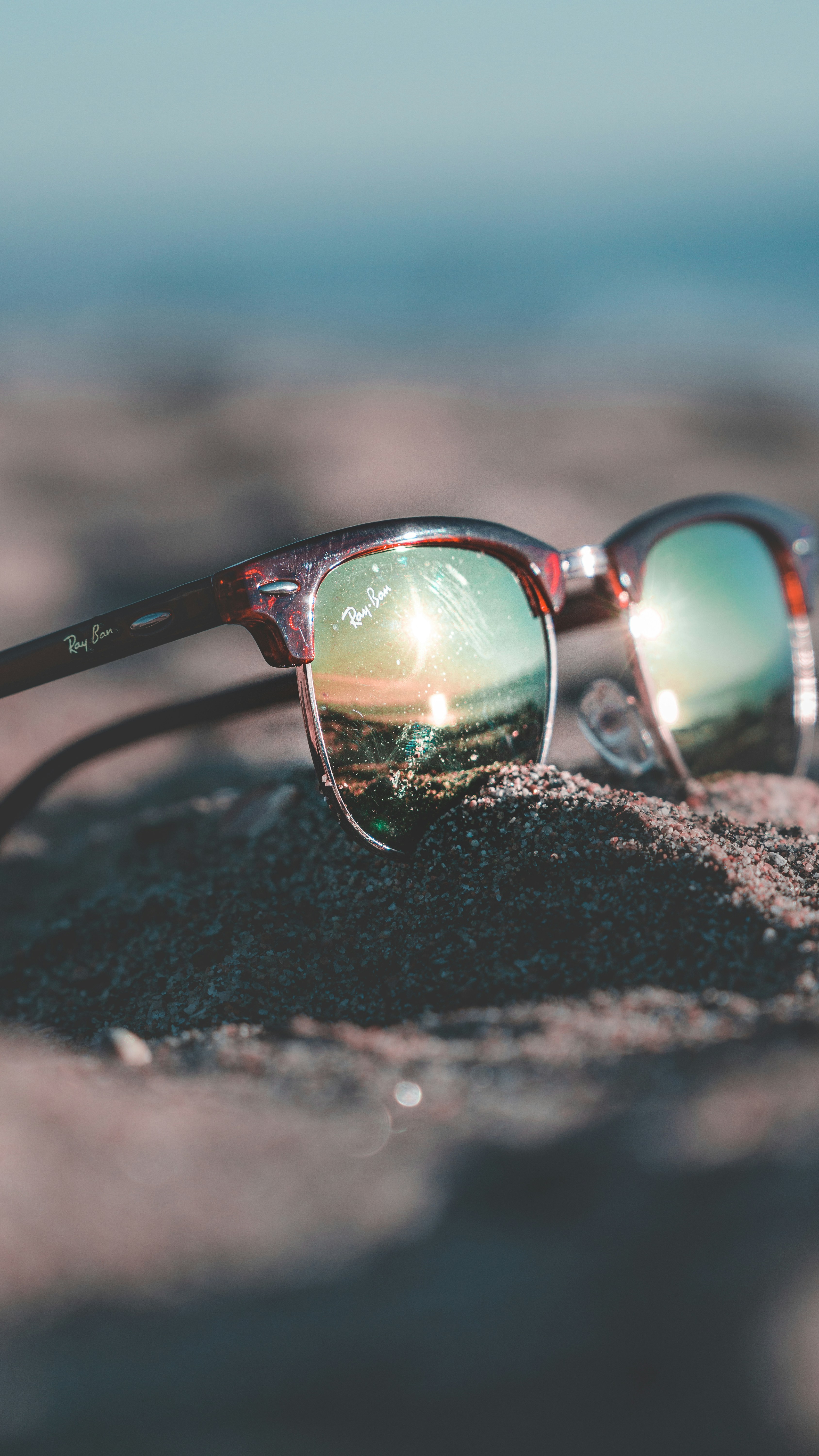 Tortoiseshell Ray Ban Clubmaster Sunglasses On Sand Photo Free Accessories Image On Unsplash