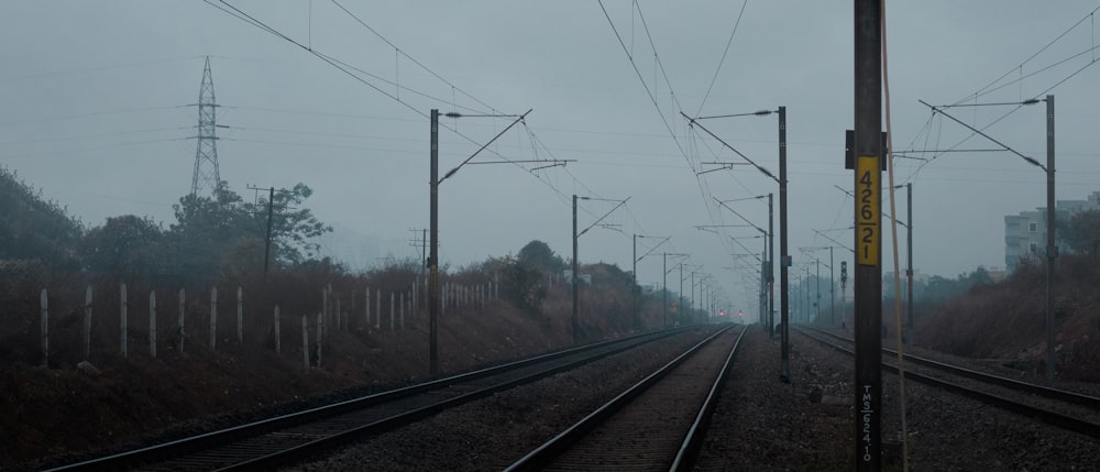 brown train railway in foggy day photo – Free Grey Image on Unsplash