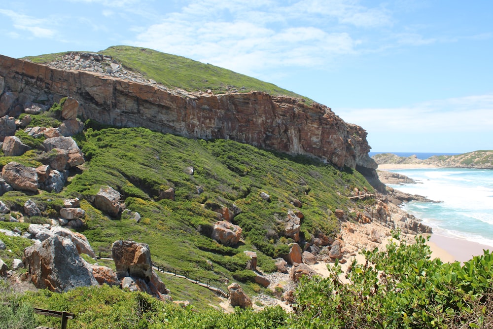 rocky grass field island during day