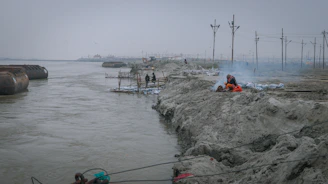 Engineers conducting environmental impact assessment near a river