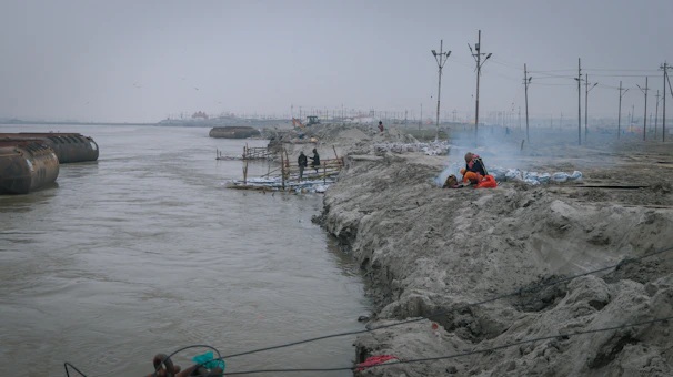 Engineers conducting environmental impact assessment near a river