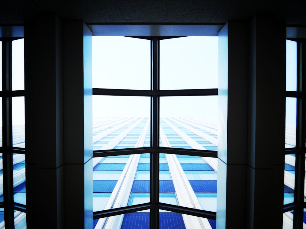 building with clear ceiling view high-rise building during day