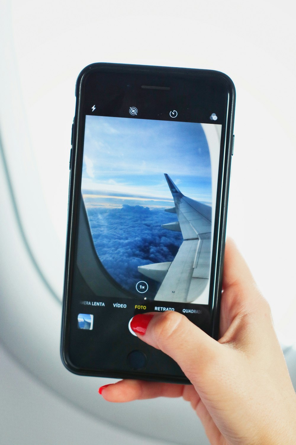 black Android smartphone showing gray airplane wing