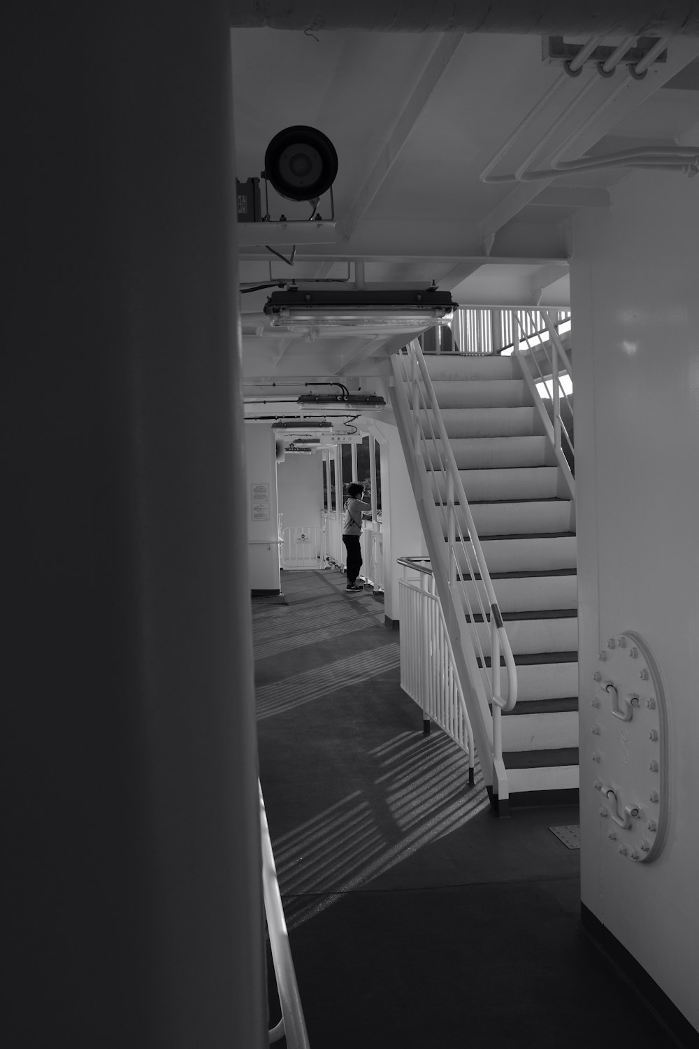greyscale photography of ship stairs