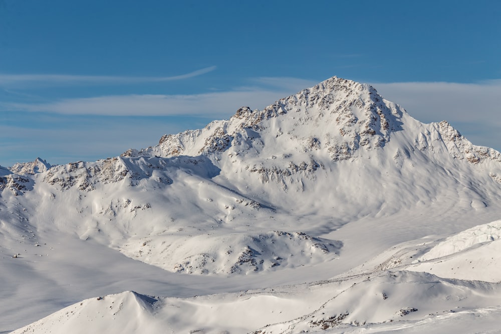 snow covered rock formation during daytime