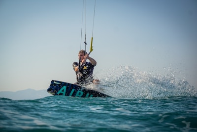 Close-up of a kitesurf instructor guiding a student during a 2-hour lesson on flat water.