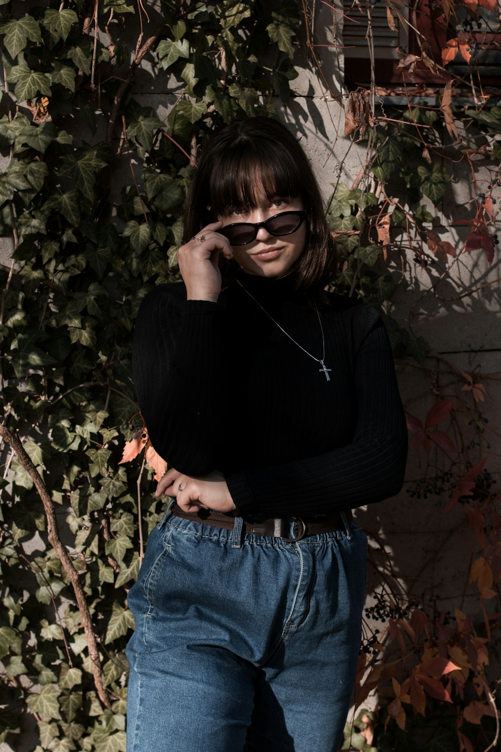 woman in black sweater and blue jeans