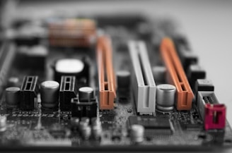 Close-up of a computer motherboard with various slots and connectors visible