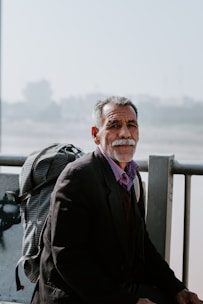 man carrying backpack