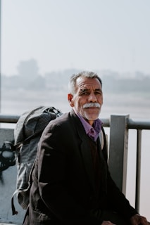 man carrying backpack