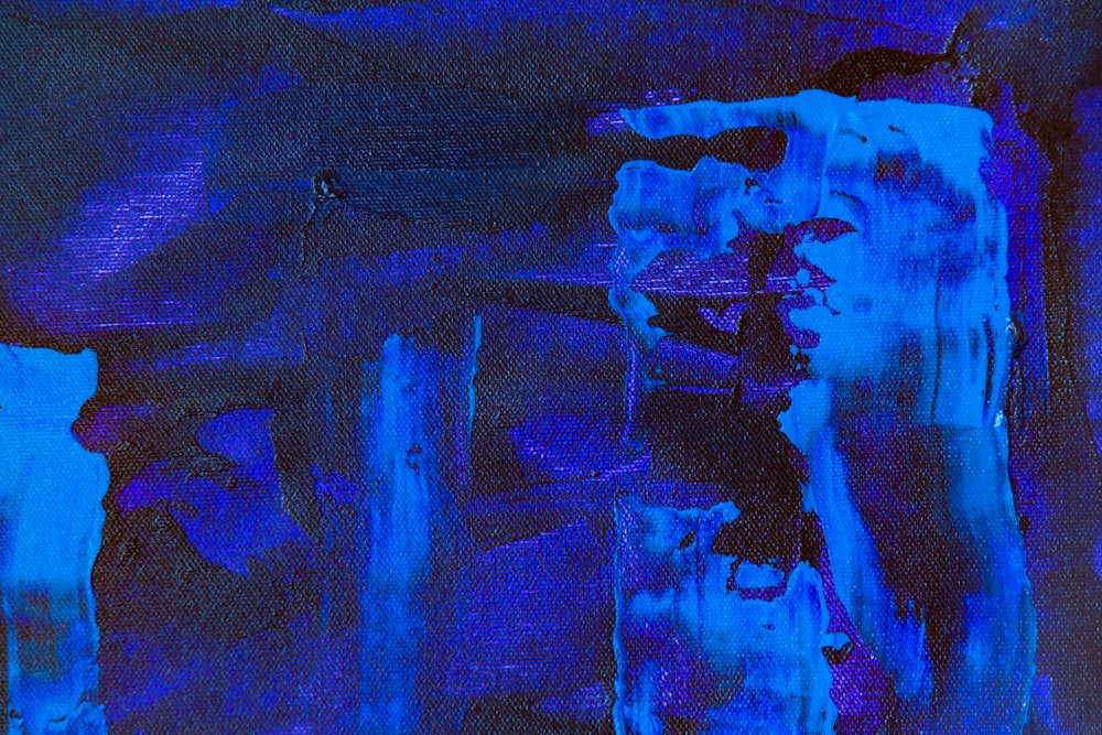 a painting with blue and black colors on it