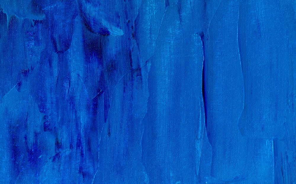 a painting of blue paint on a wall