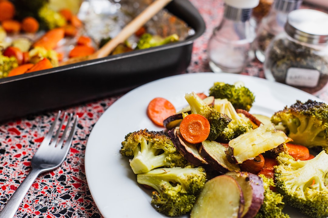 broccoli salad on plate beside fork