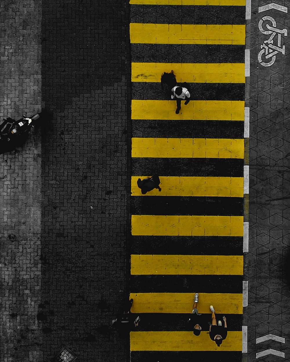 several people walking along a pedestrian lane