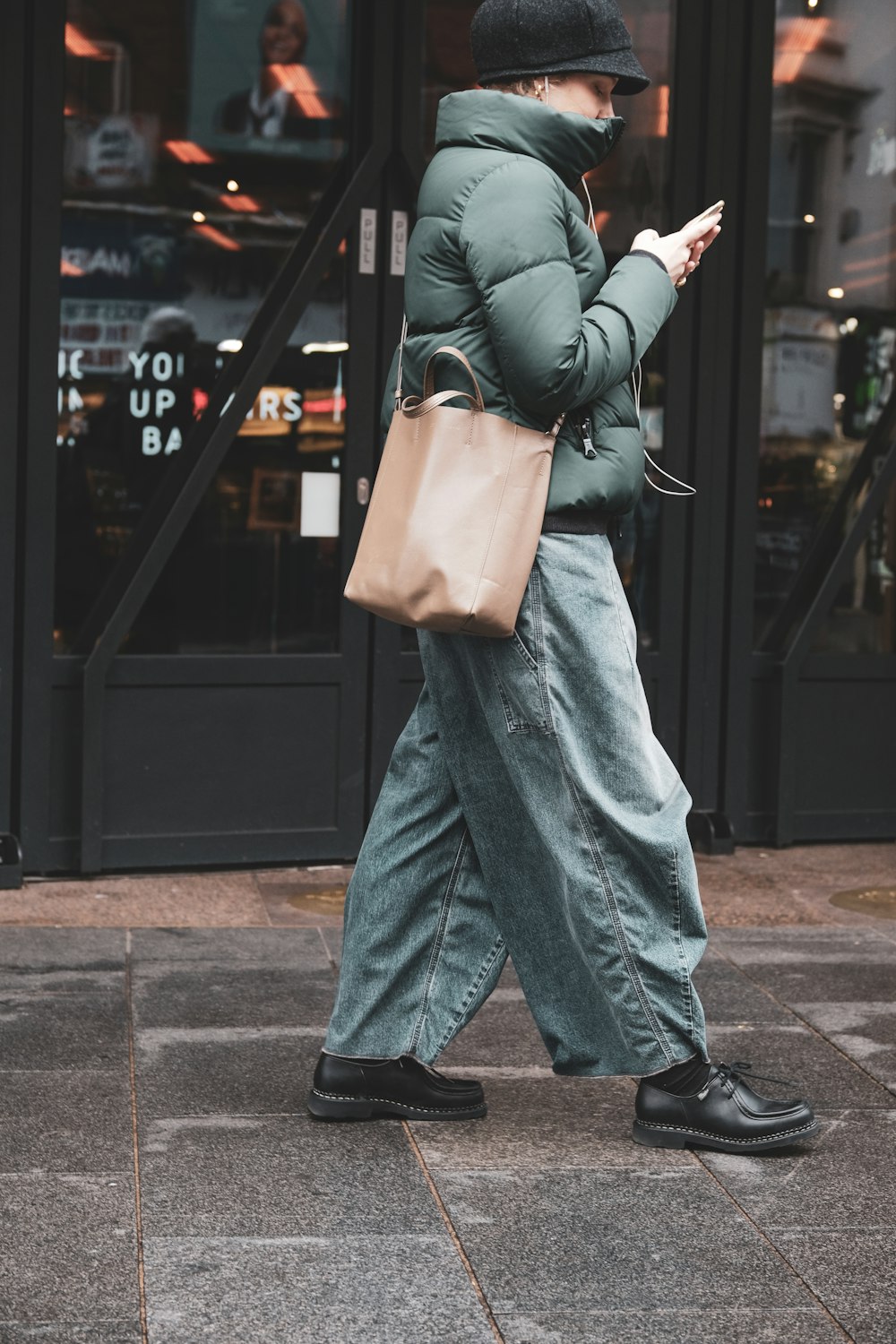 walking woman while using smartphone