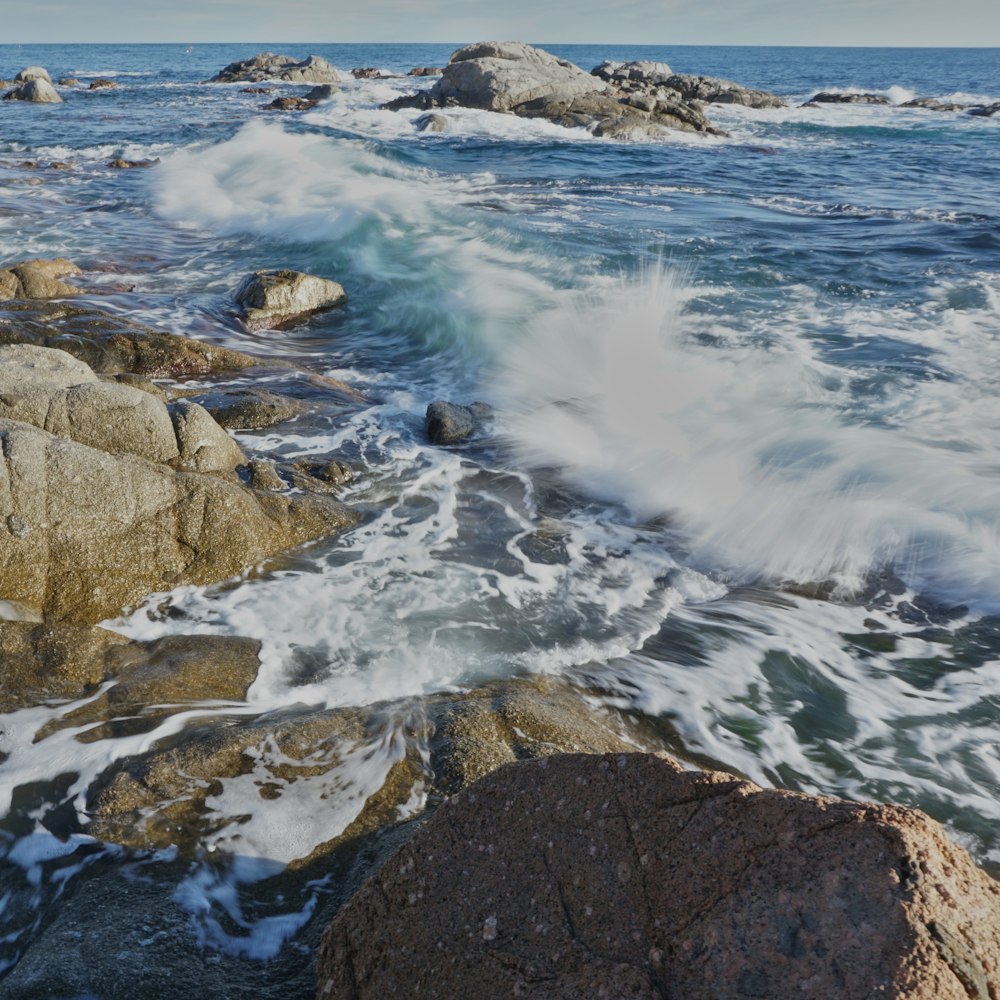 seawaves smashing on rocks