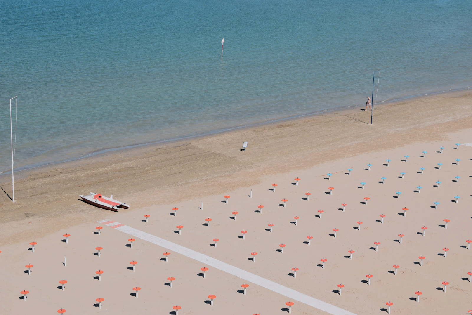 The grid of parasols and sun loungers on Rimini’s beach, seen from above