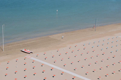 The grid of parasols and sun loungers on Rimini’s beach, seen from above