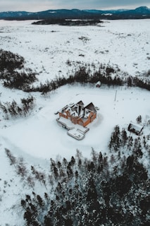 A satellite view of a sprawling bitcoin mining data center nestled in the snowy landscapes of Finland.