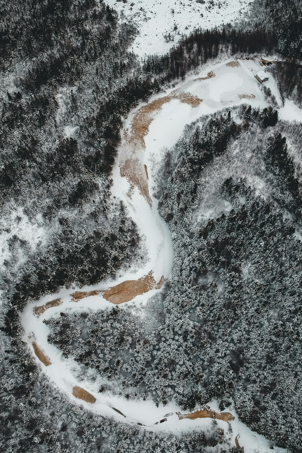 snow covered road during daytime