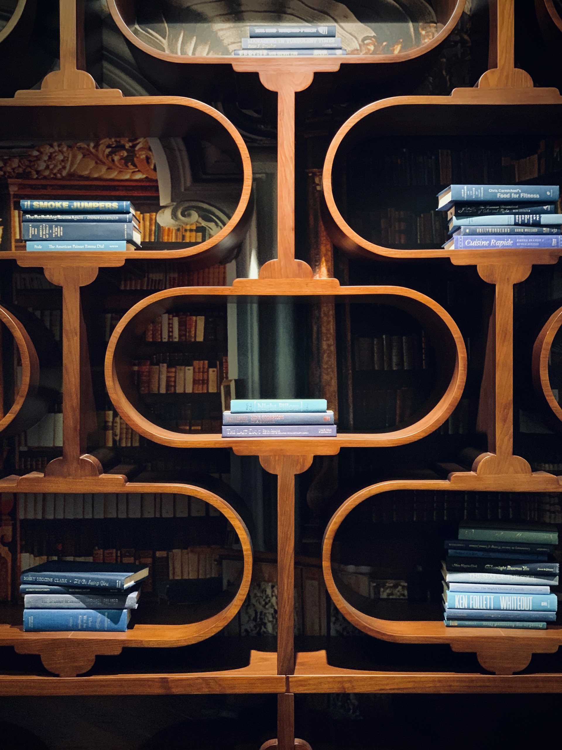 books on brown wooden shelf