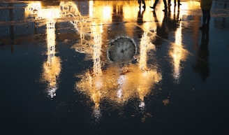 Close-up of a glowing pool reflector illuminating water at night