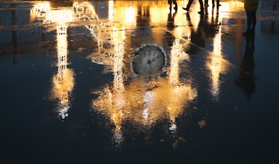 Close-up of a glowing pool reflector illuminating water at night