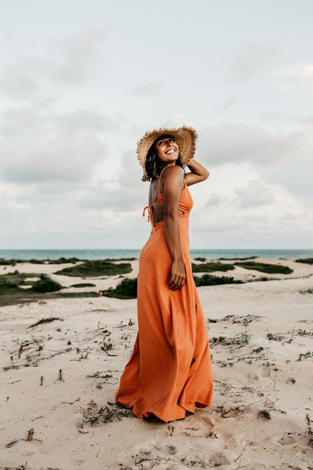 woman wearing orange dress