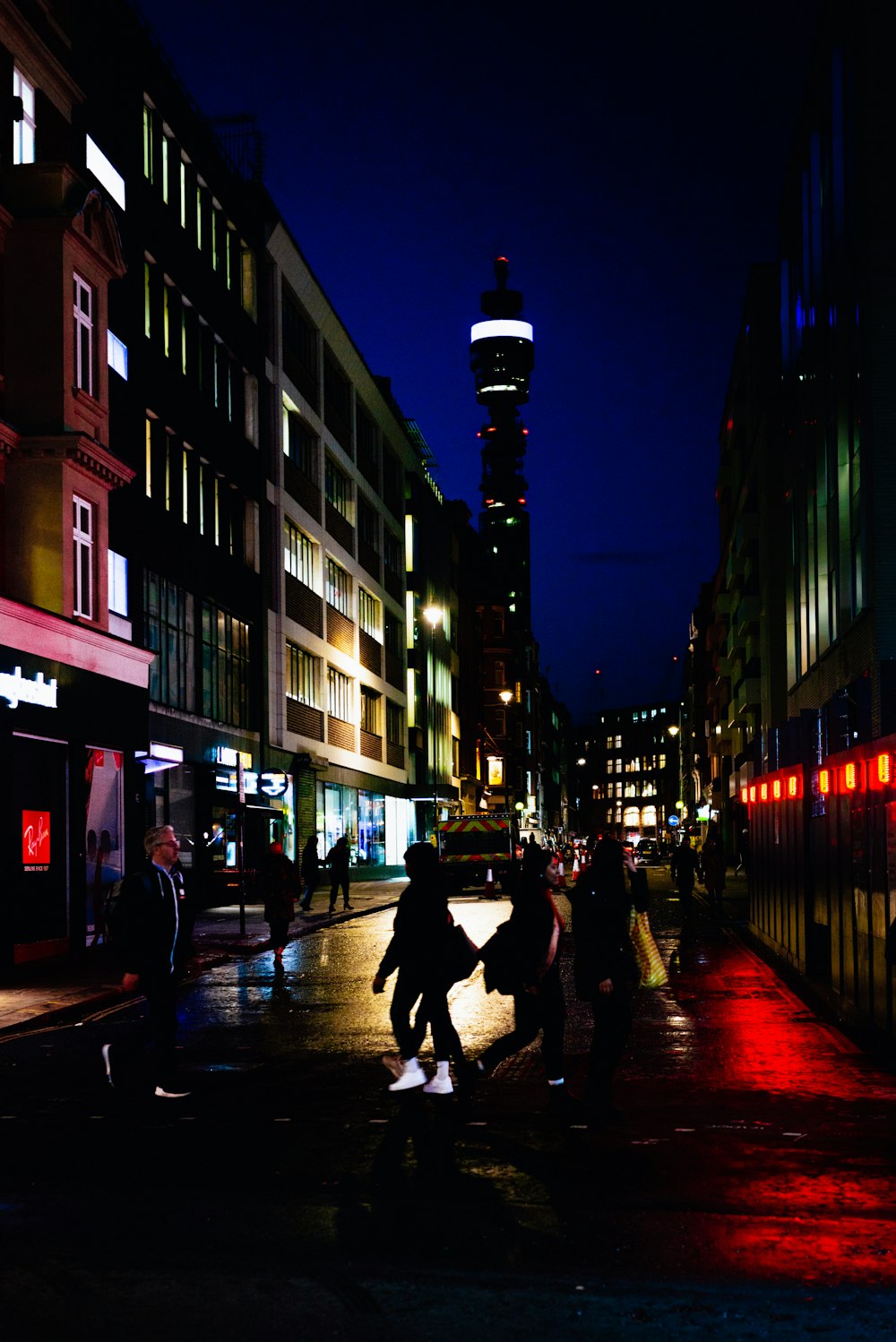 people walking on street during night time