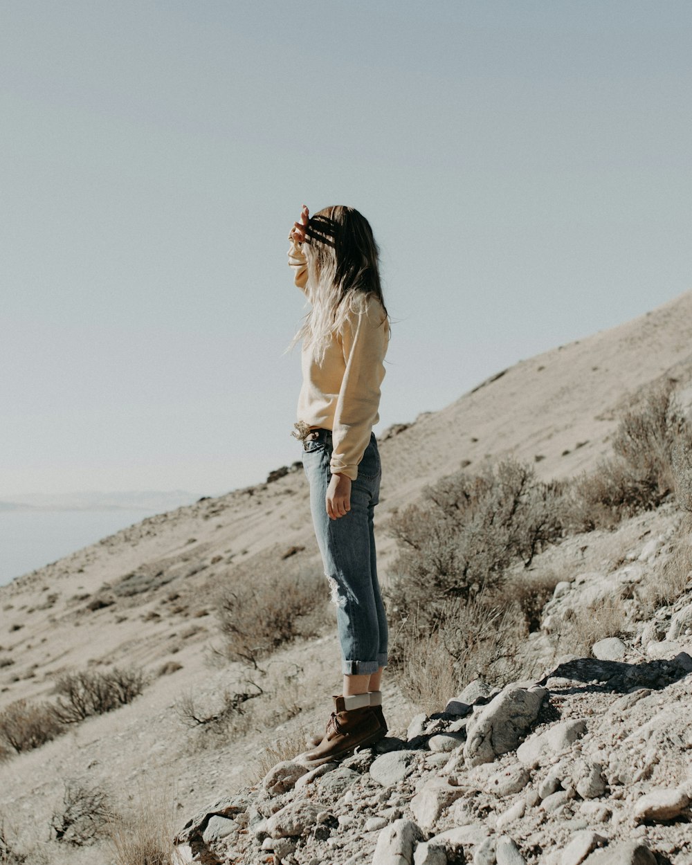 woman standing on hill