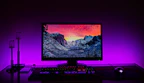 A high-resolution curved monitor displaying a vivid nature scene.