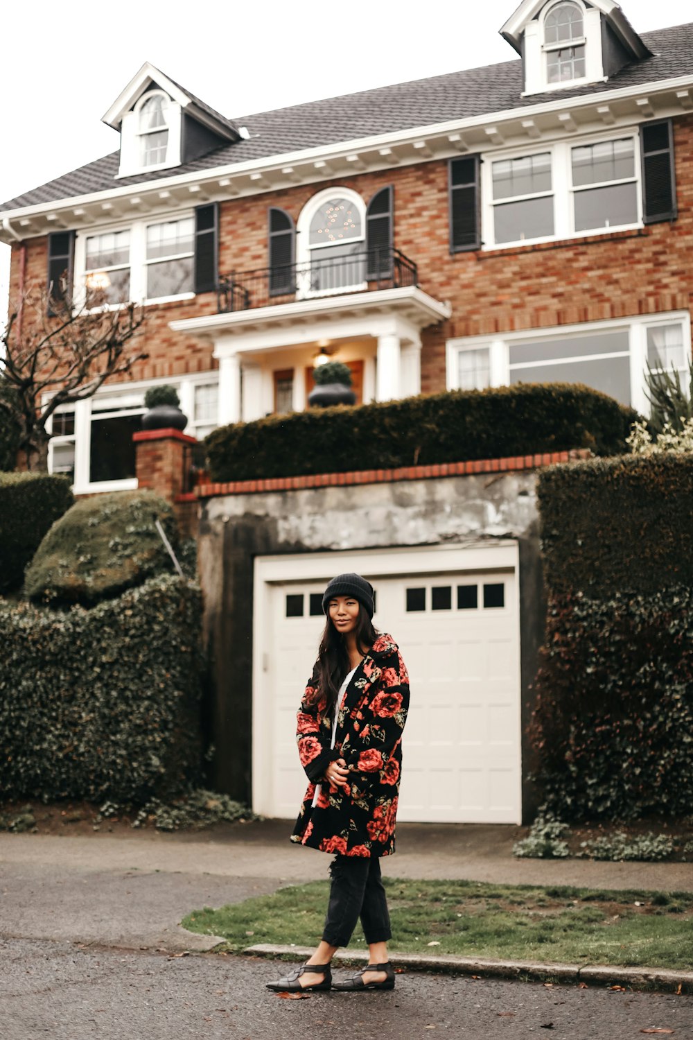 woman standing in front of house during daytime