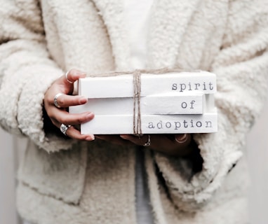 woman holding spirit of adoption blocks