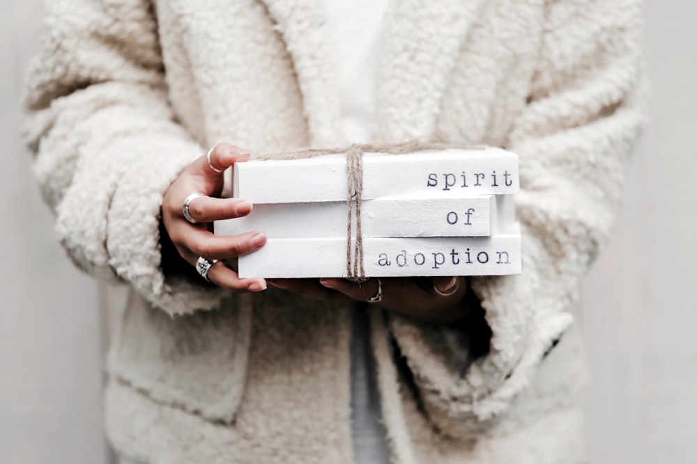 woman holding spirit of adoption blocks