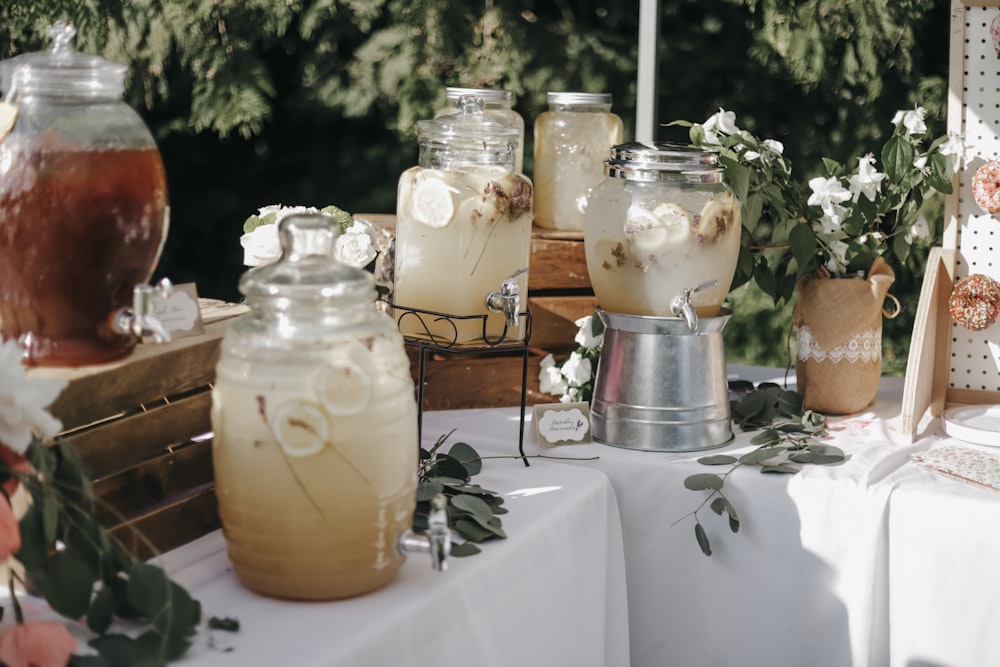 shallow focus photo of clear glass beverage dispensers