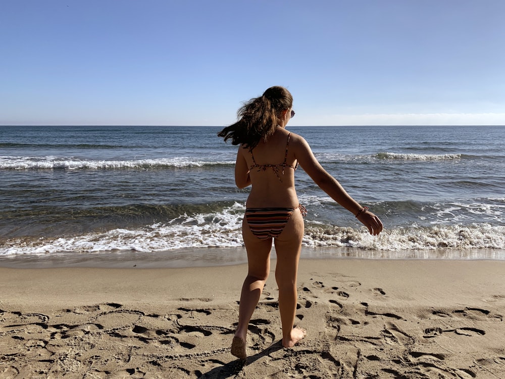 woman standing on shore