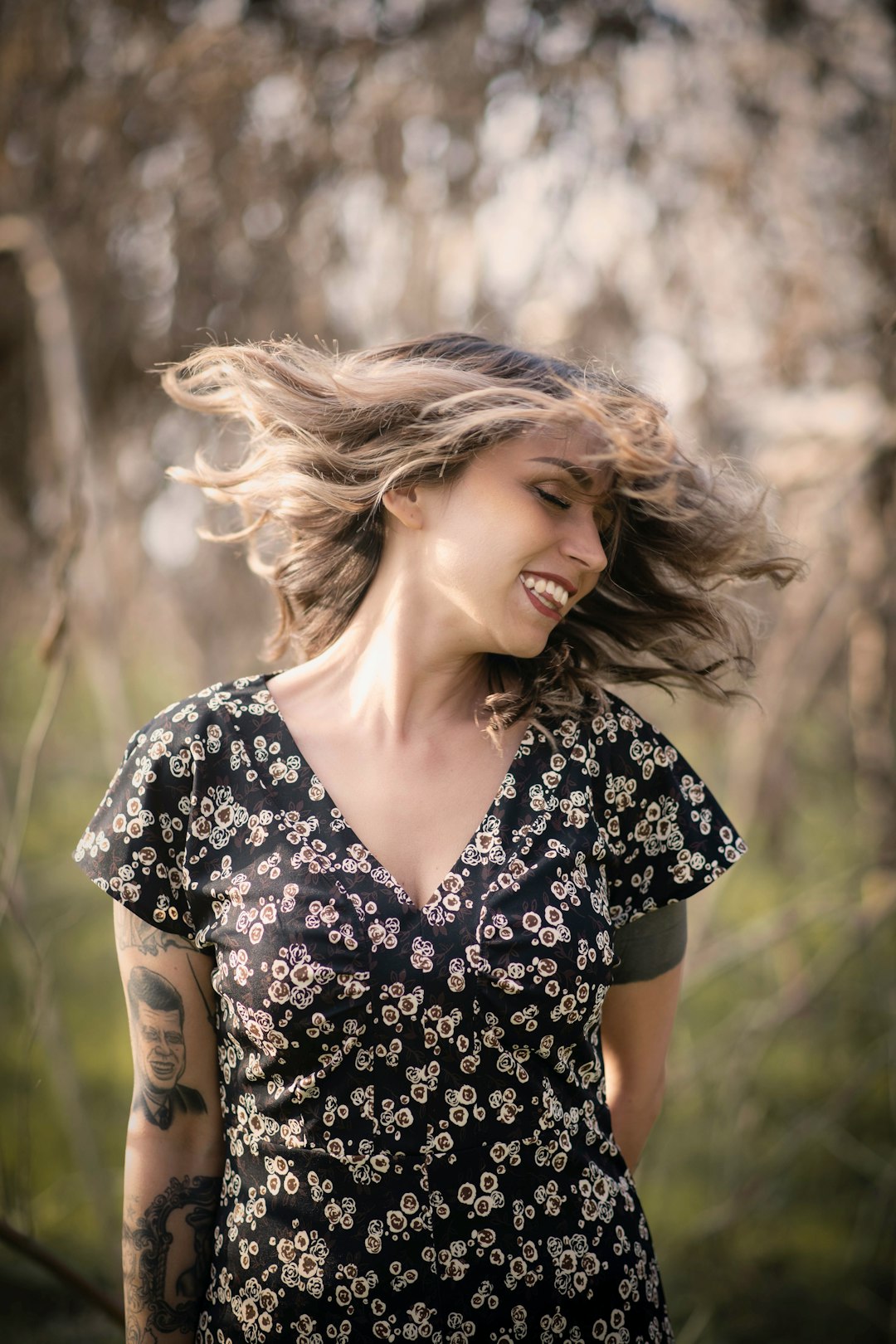 woman wearing black and white floral V-neck dress