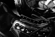 Close-up of a pair of classic leather boots with detailed stitching, highlighting quality craftsmanship.