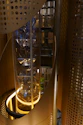 Elegant elevator shaft subtly integrated into a minimalist luxury home environment.