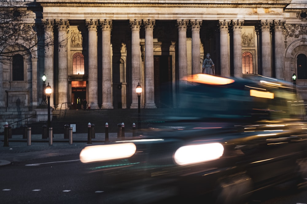 a blurry photo of a bus in front of a building