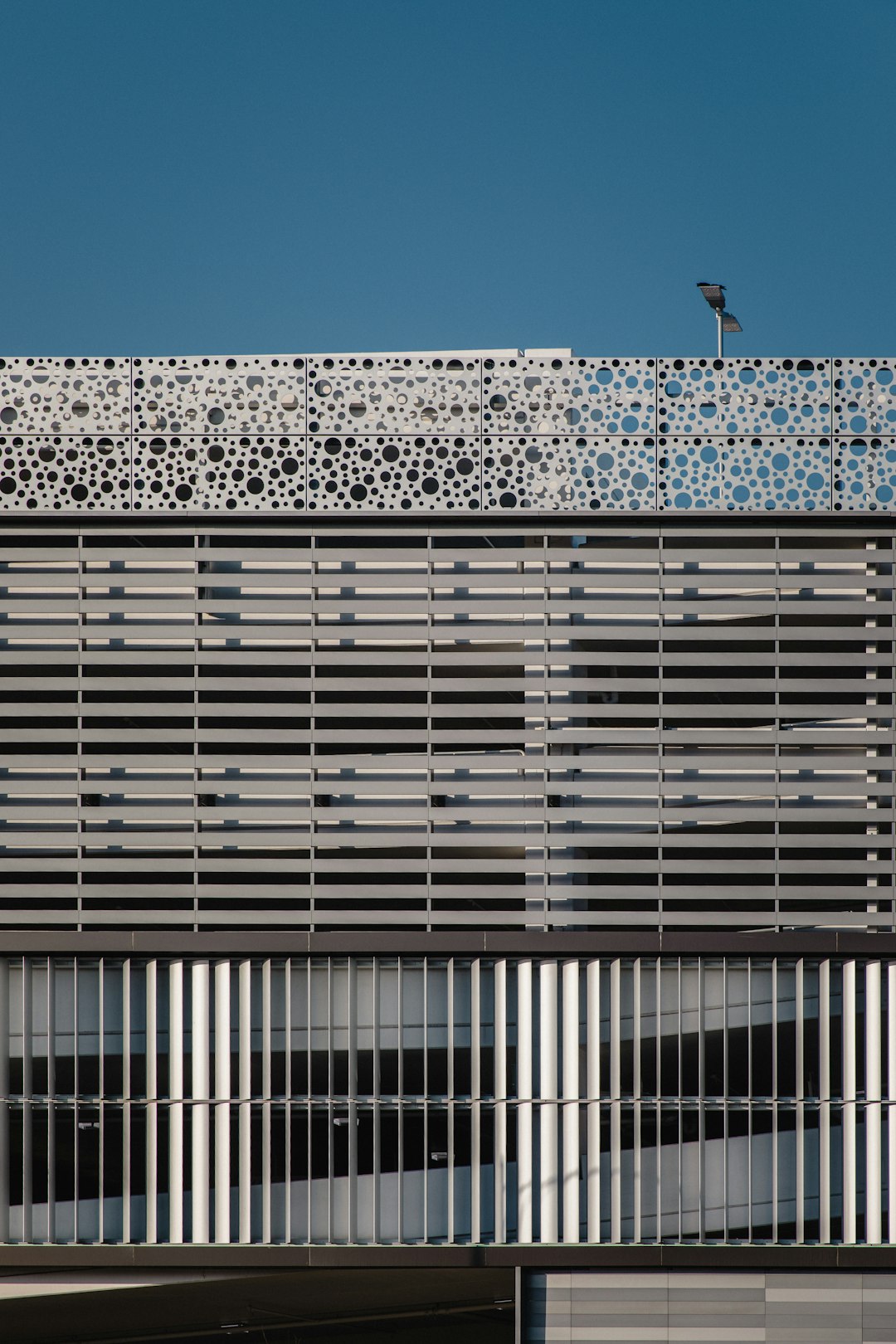 gray concrete building under clear blue sky during daytime