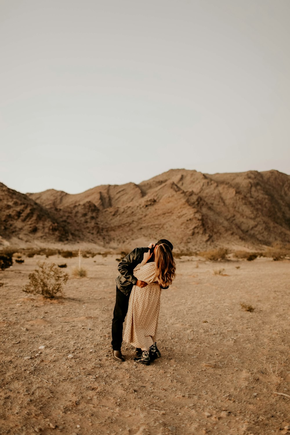 man and woman kissing each other