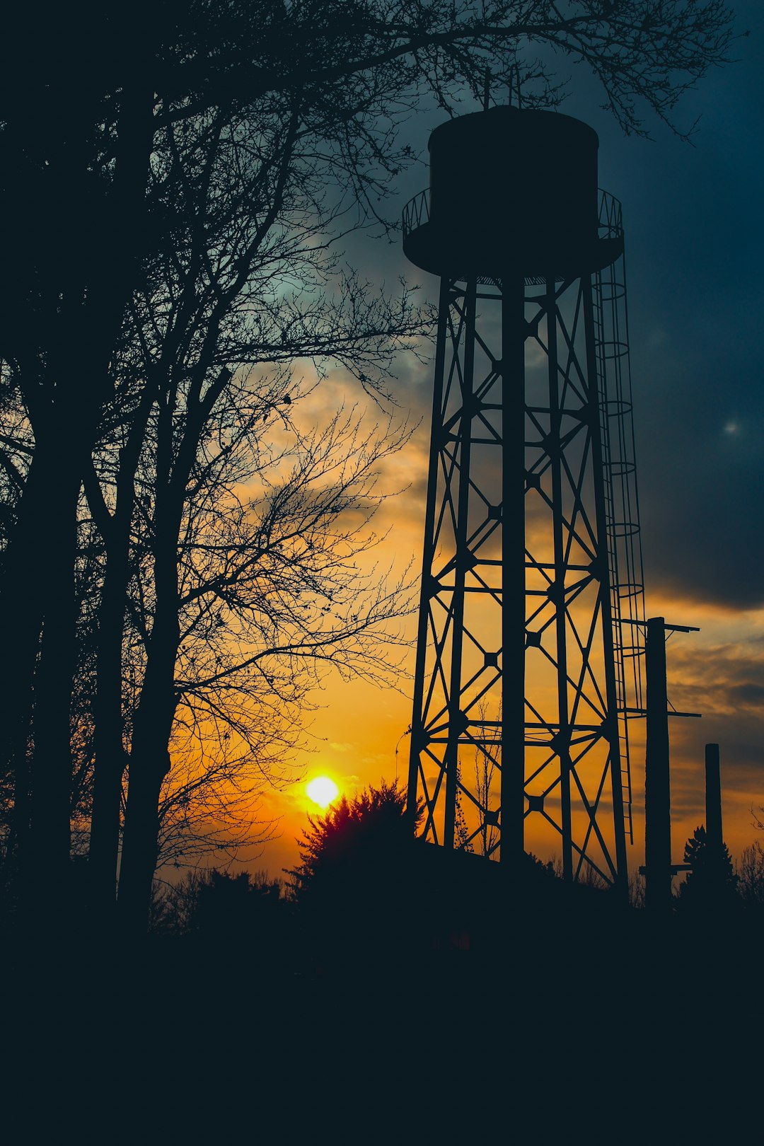 silhouette photography of water tank