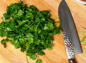 green parsley beside gray knife