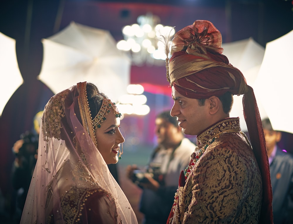 man and woman facing each other and smiling