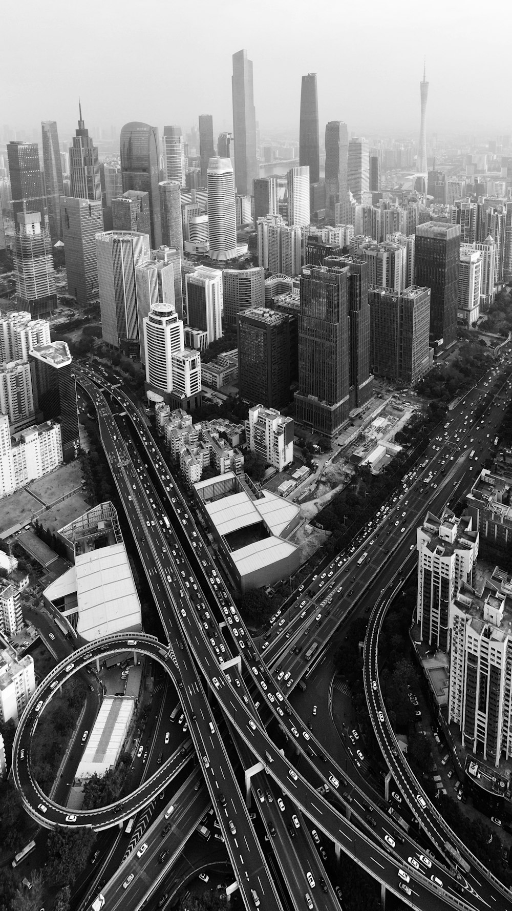 a black and white photo of an aerial view of a city