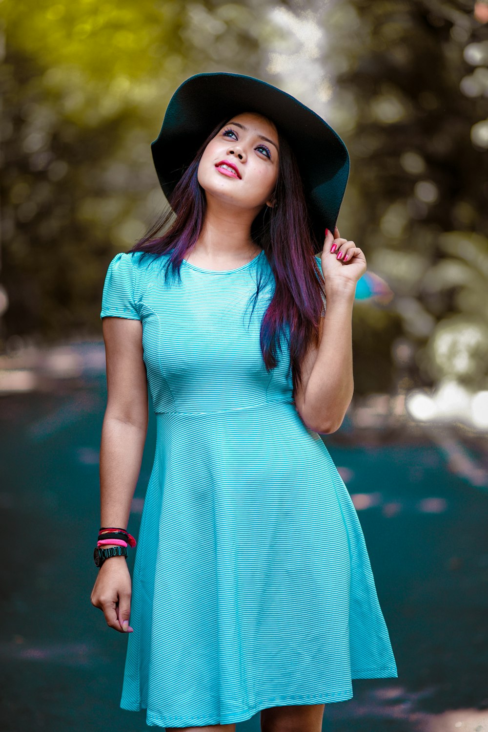 woman looking upwards during day