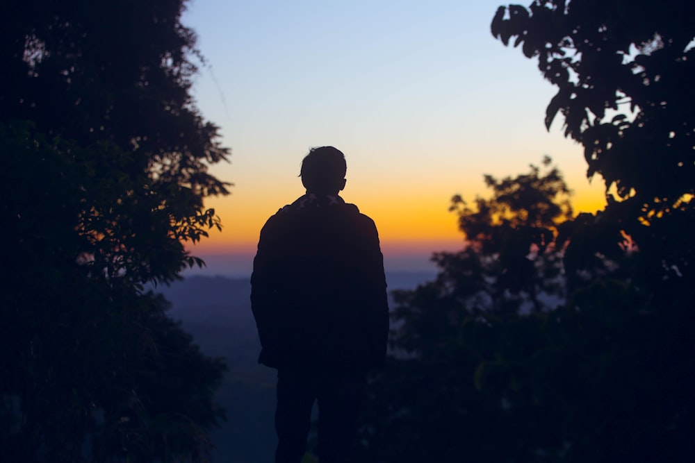 man standing near tree